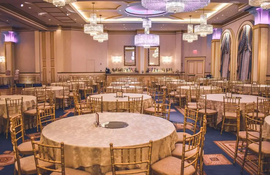 VIP furniture rental Saudi Arabia — luxury banquet hall setup with gold chairs
