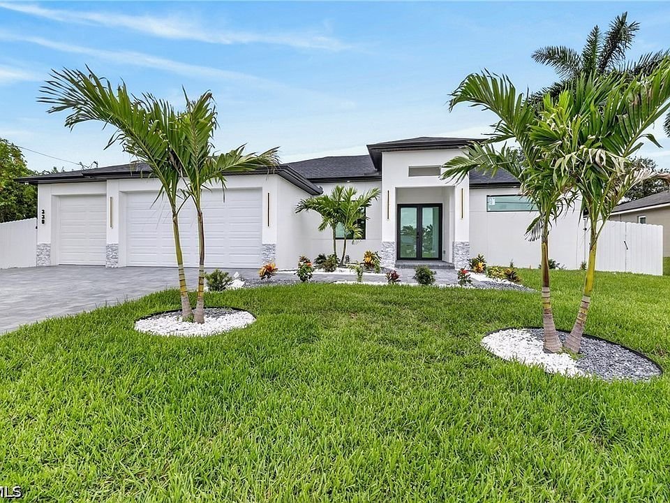 Luxury home with lush green artificial grass lawn showing professional landscaping and year-round beautiful aesthetic