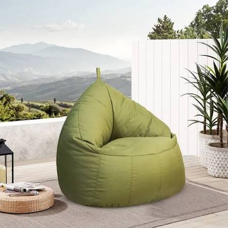 Blue and red bean bags arranged in modern room with decorative pillows creating comfortable lounge space