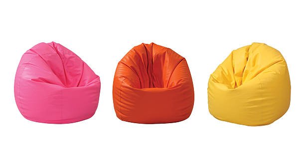 Colorful bean bags in pink, orange and yellow showing variety of vibrant lounge seating options