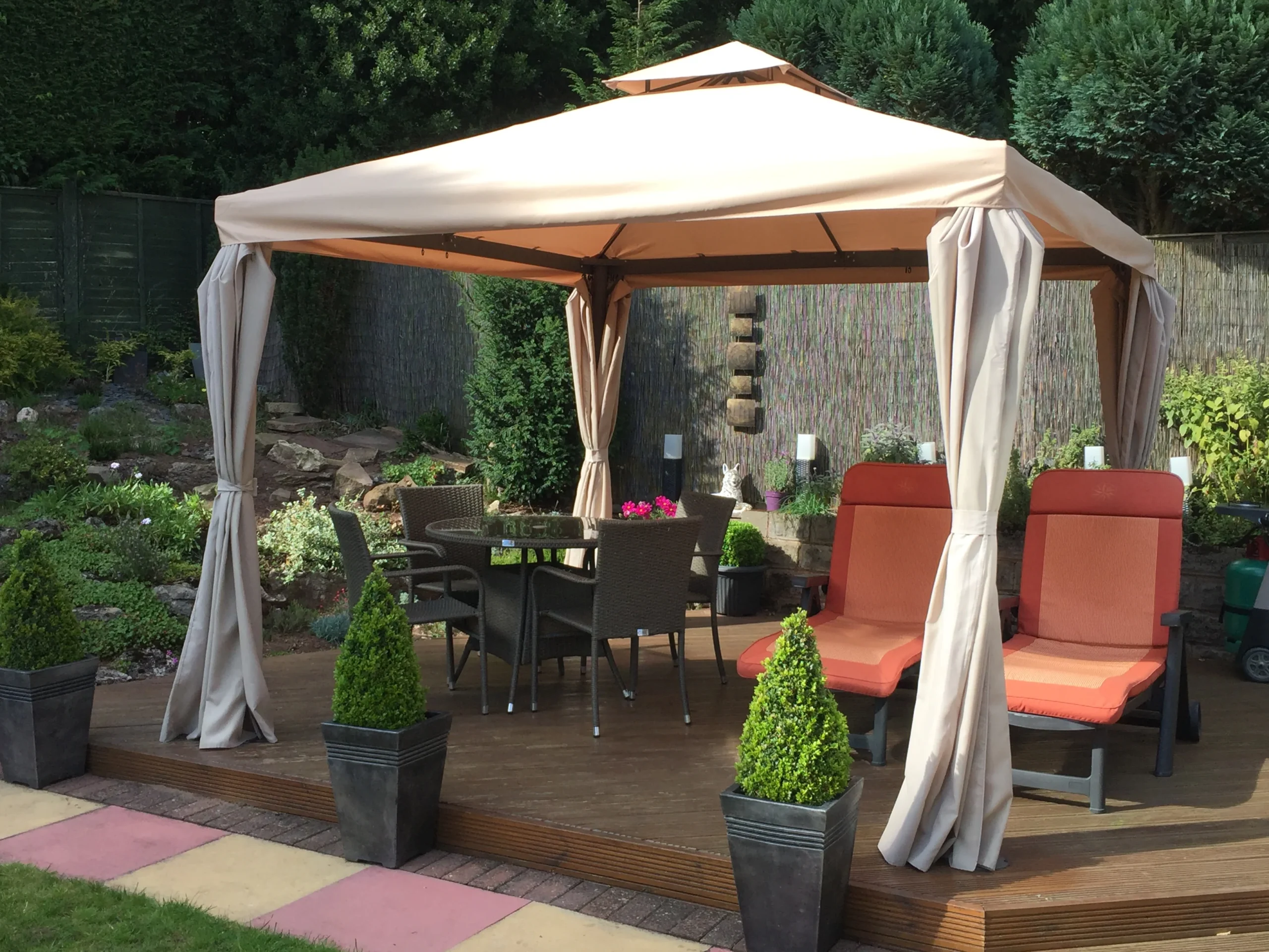 Contemporary black and white pergola canopy attached to residential building