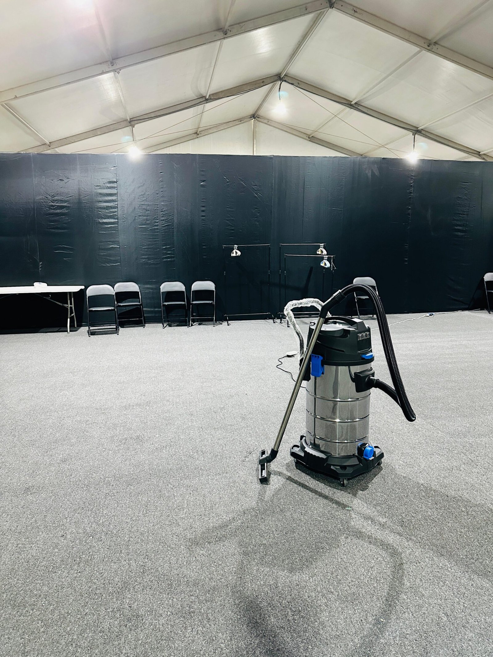 Premium carpet flooring with event furnishings and lighting