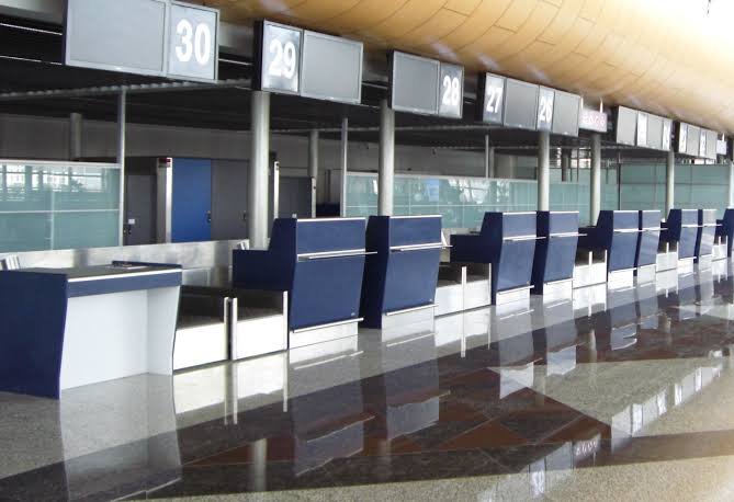 Row of self-service check-in kiosk counters with digital signage rental Saudi Arabia