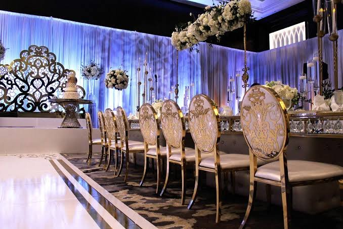 Long gold banquet table with cherry blossom canopy and candelabras engagement party rental KSA
