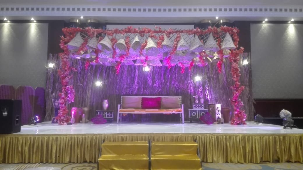 Outdoor wedding kosha stage with chandeliers and floral centerpiece rental KSA