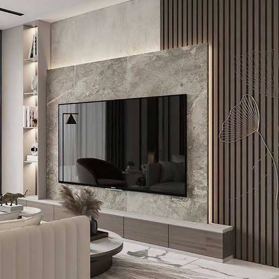 Modern media wall with stone slab panels wood slat accent and floating TV unit with concealed lighting KSA