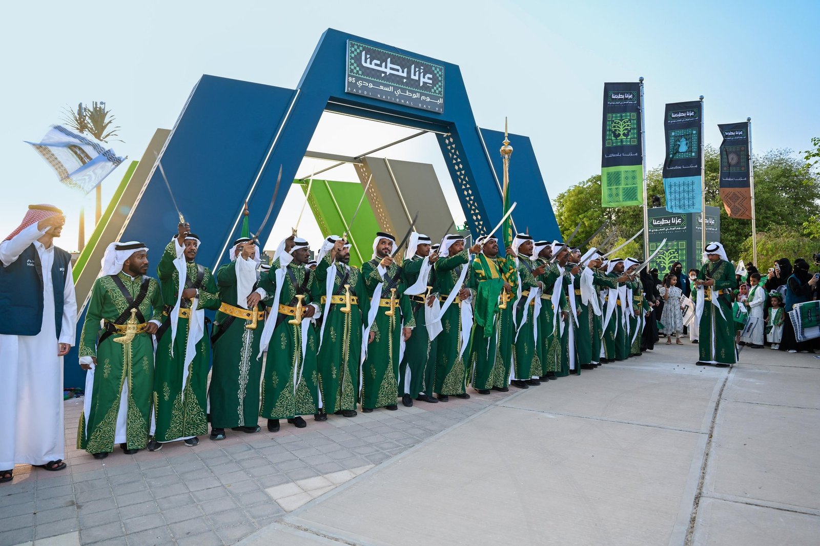 VIP classic armchairs with elegant side tables and floral arrangements at official ceremony front row Saudi Arabia National Day event furniture rental