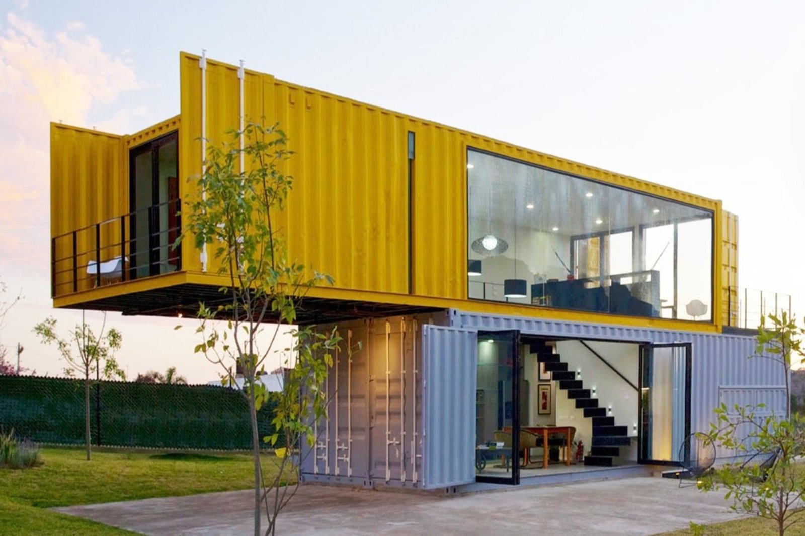 Modern black portable container with large sliding glass doors and professional workspace design