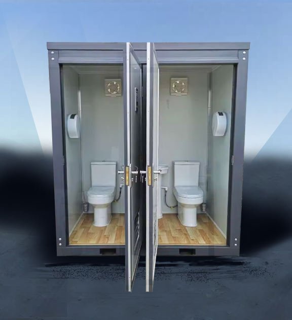 Dual portable restroom units in gray showing two toilets in one compact block configuration