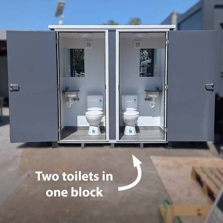 Multiple portable toilet units arranged in formation with professional industrial design and branding