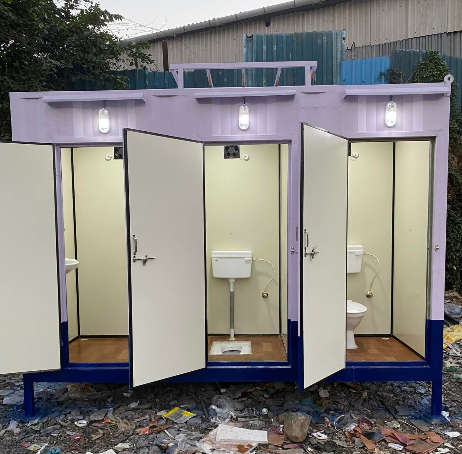 Standard white portable toilet unit with blue water tank and professional sanitation features