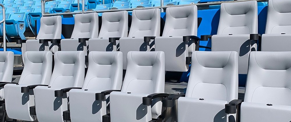 Branded blue VIP hospitality bench seating pitch side rental Saudi Arabia
