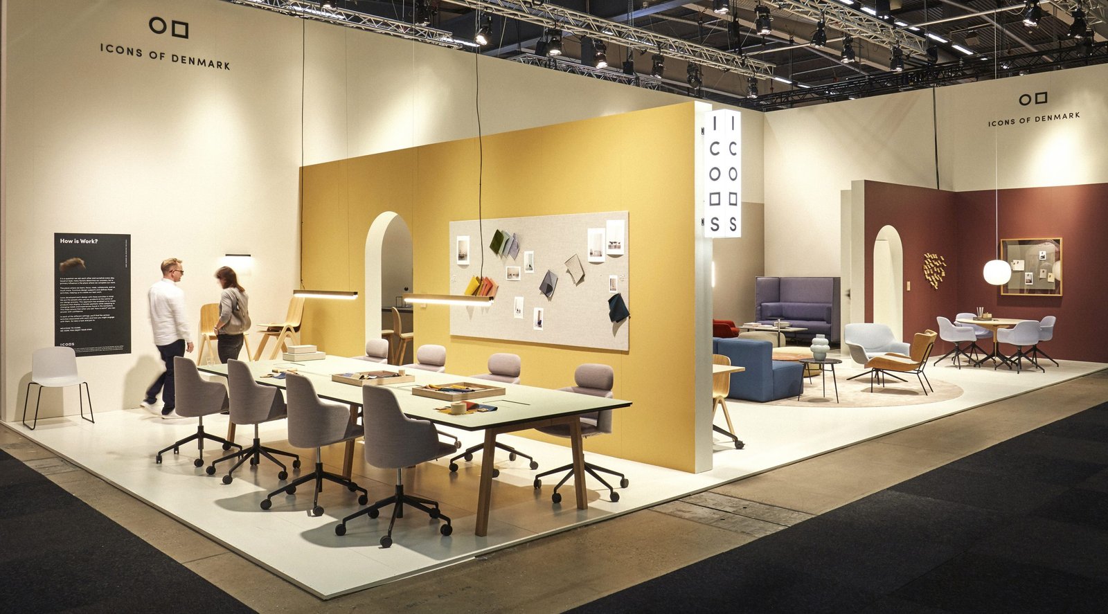 Contemporary trade show booth with blue and white design, LED lighting and demo stations